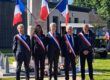 le maire et ses adjoints encadrant le préfet de l'Eure devant le monument aux morts